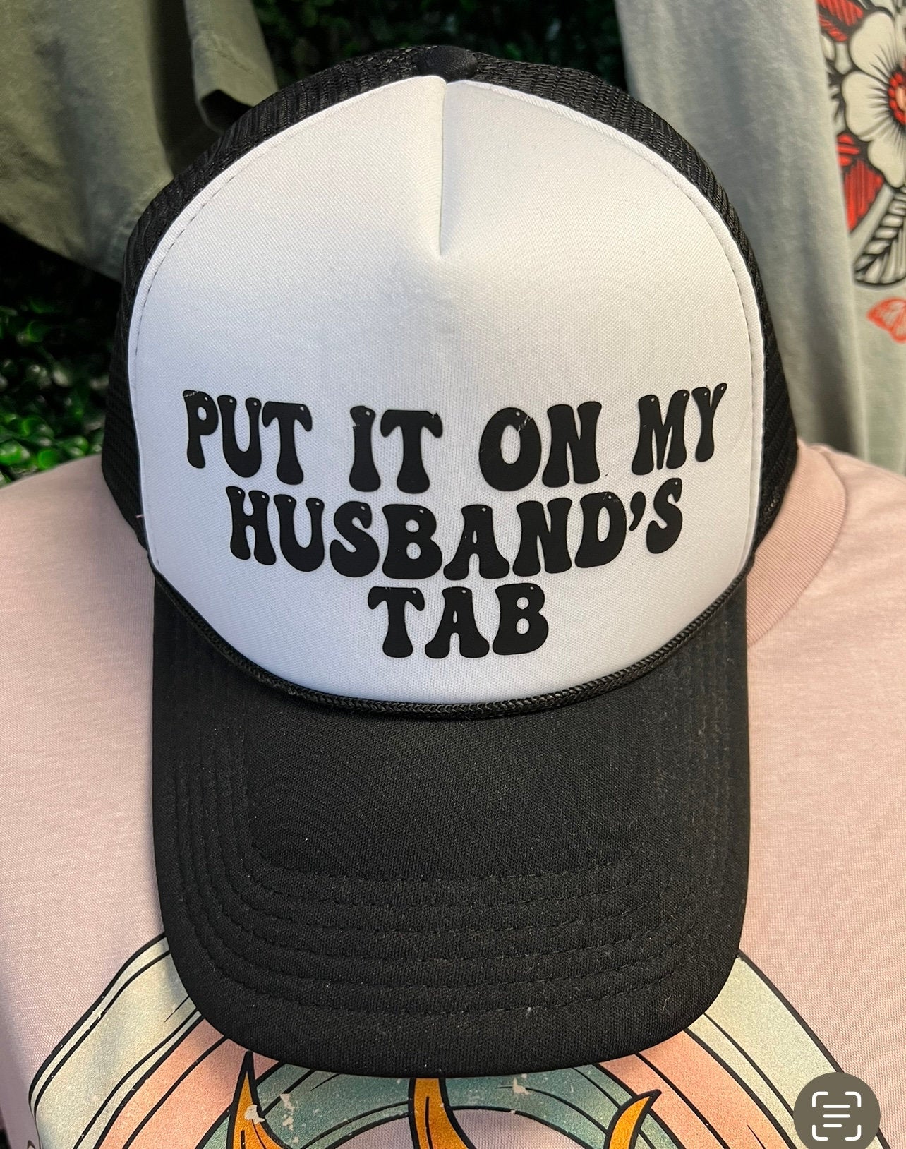 Put it on my husbands tab Trucker hat